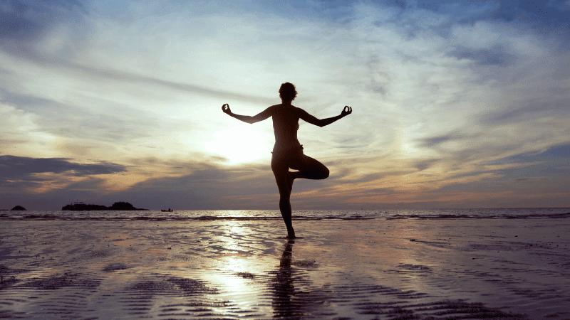 A person in a balanced pose, symbolizing the importance of a balanced finish in golf.